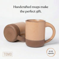 Wheat mug on its side with a 12 oz capacity callout