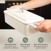 Hands holding the closed loaf bread oven: enameled finish, easy cleanup, non-stick surface