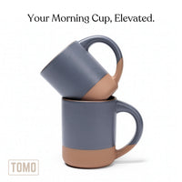 Two Harbor Blue mugs stacked, showing the unglazed clay foot